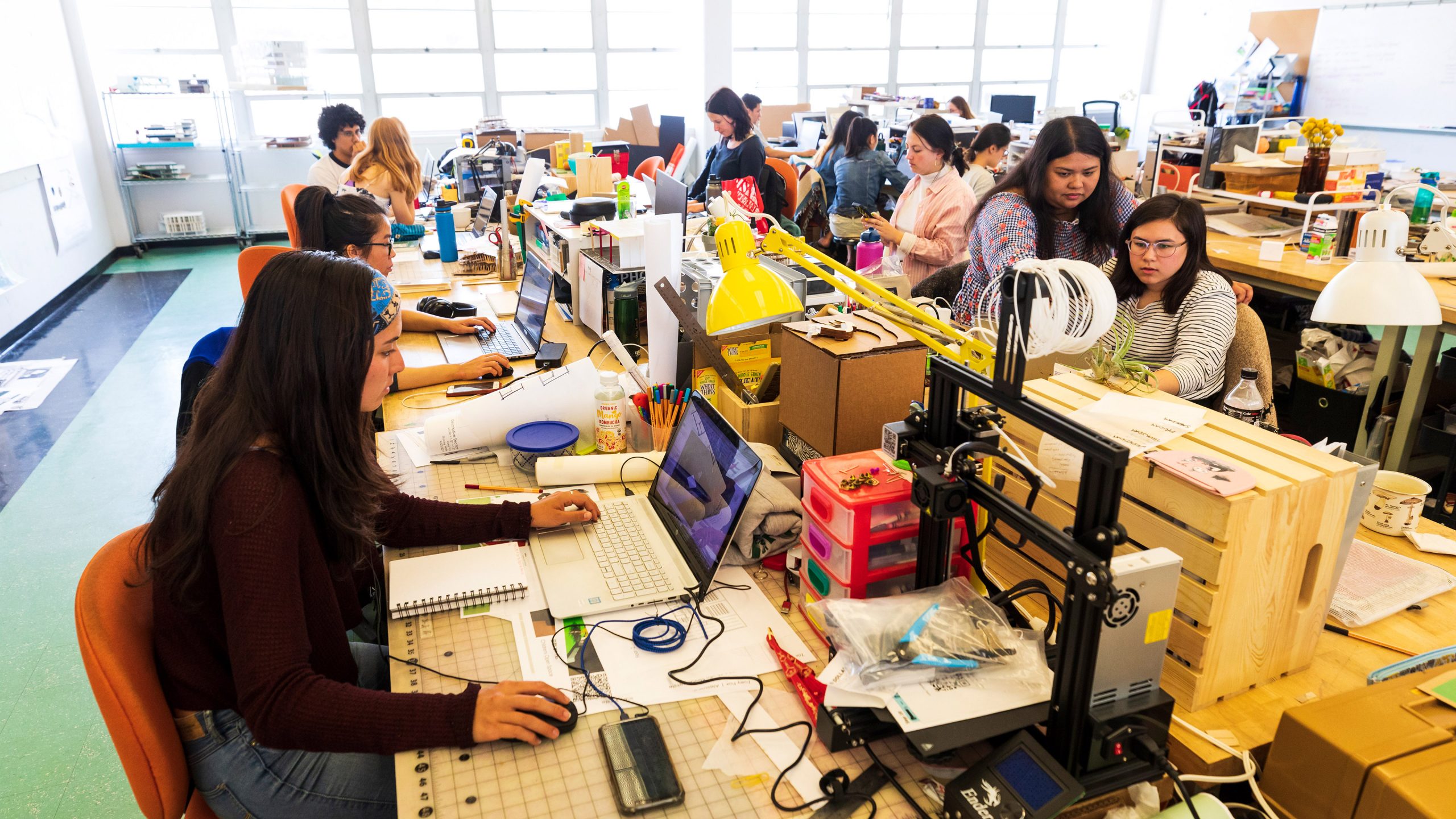 Architecture students work on designs in their studio on campusto help rebuild the town of Paradise. Photo by Joe Johnston.