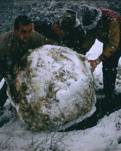 Students build a snowman in 1962. 