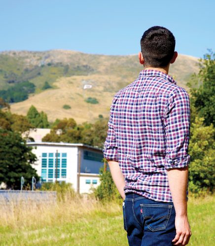 Larry Peña looks toward the P on Cal Poly's campus