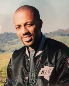 Alumnus Michael Welch smiles in a black LA Kings jacket.