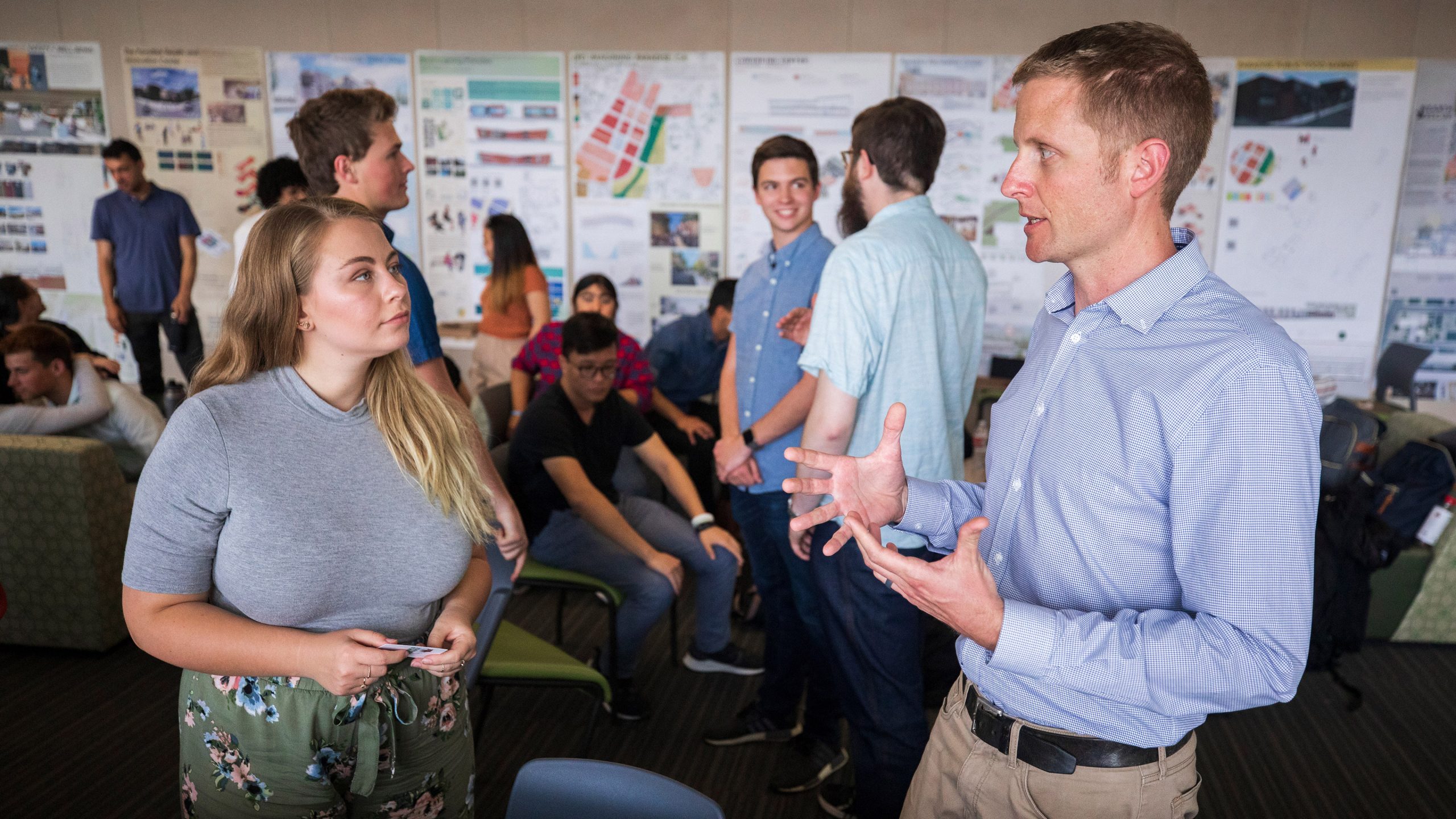 Architecture student Natalie Giombi talks to Paradise resident Charles Brooks about her design project at CSU Chico. Photo by Joe Johnston.