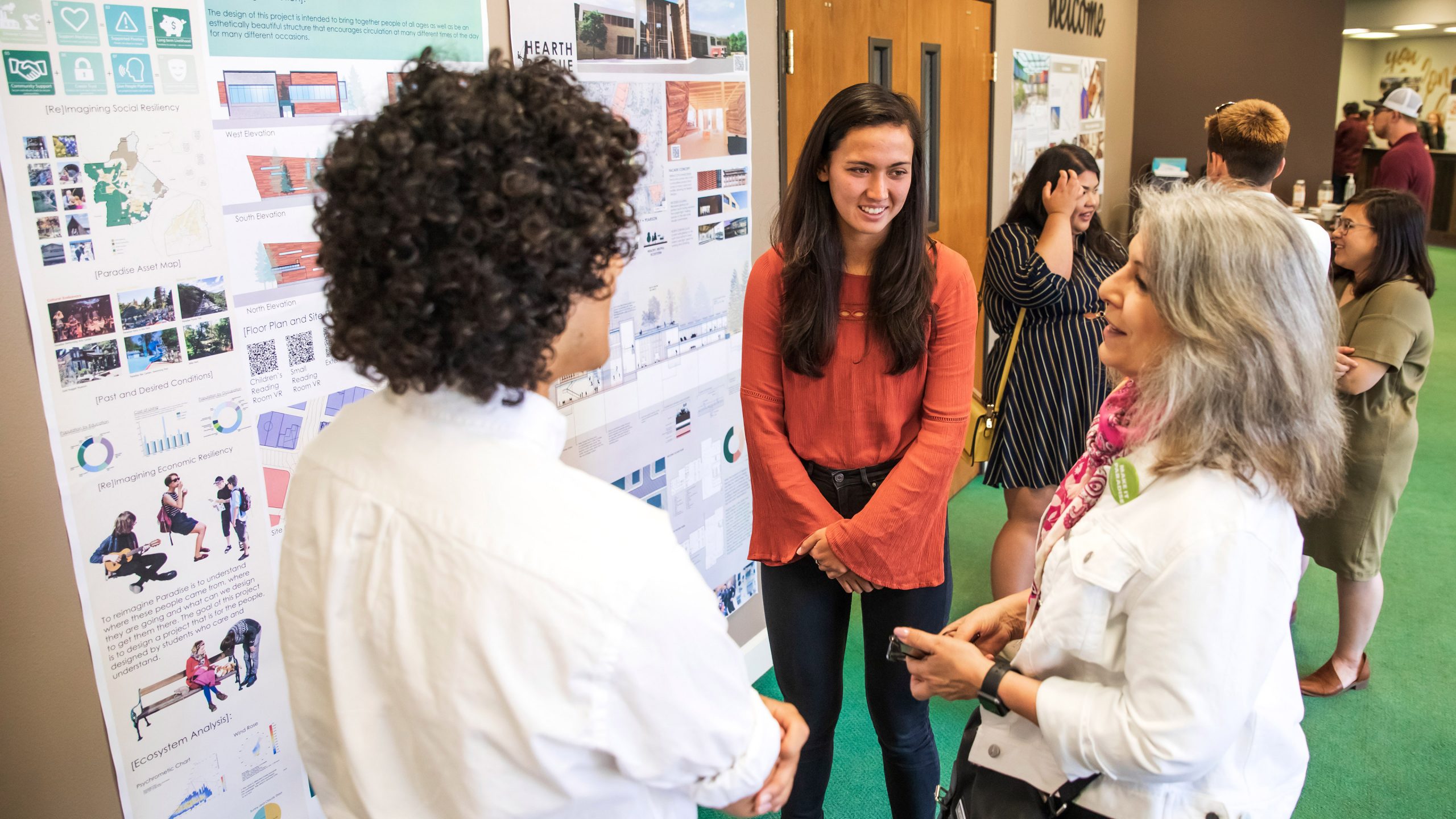 Architecture students Alessandro Zhangi and Zoey Fox present their project to Paradise Town Council Member Melissa Schuster in Paradise. Photo by Joe Johnston.