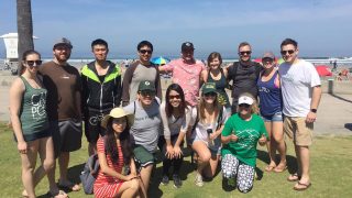 Fourteen members of the San Diego Alumni Chapter at a local beach clean up day in 2018.