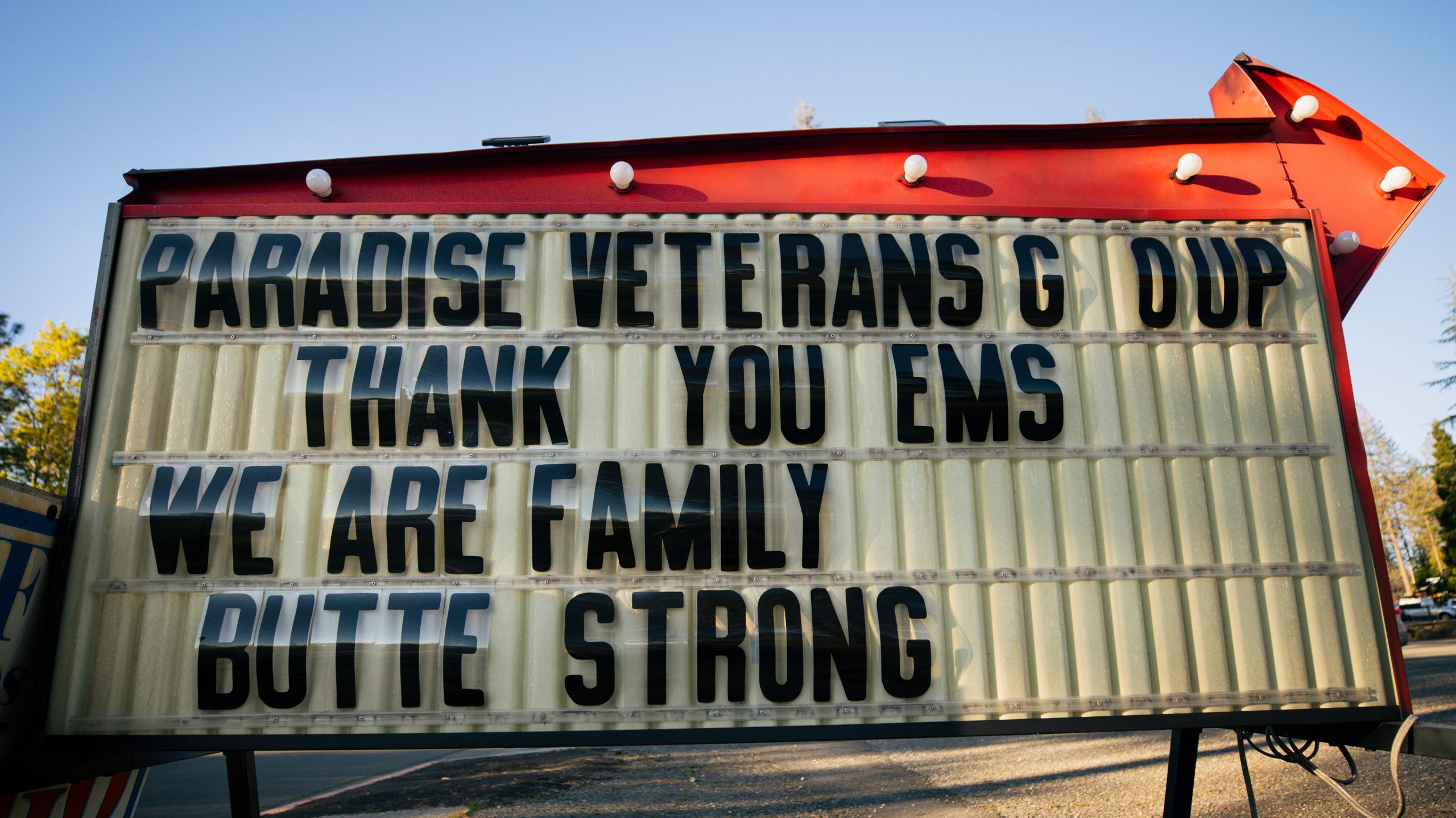 A sign in Paradise, CA, reads, "Paradise Veterans G[r]oup Thank You EMS We Are Family Butte Strong." Photo by Joe Johnston.