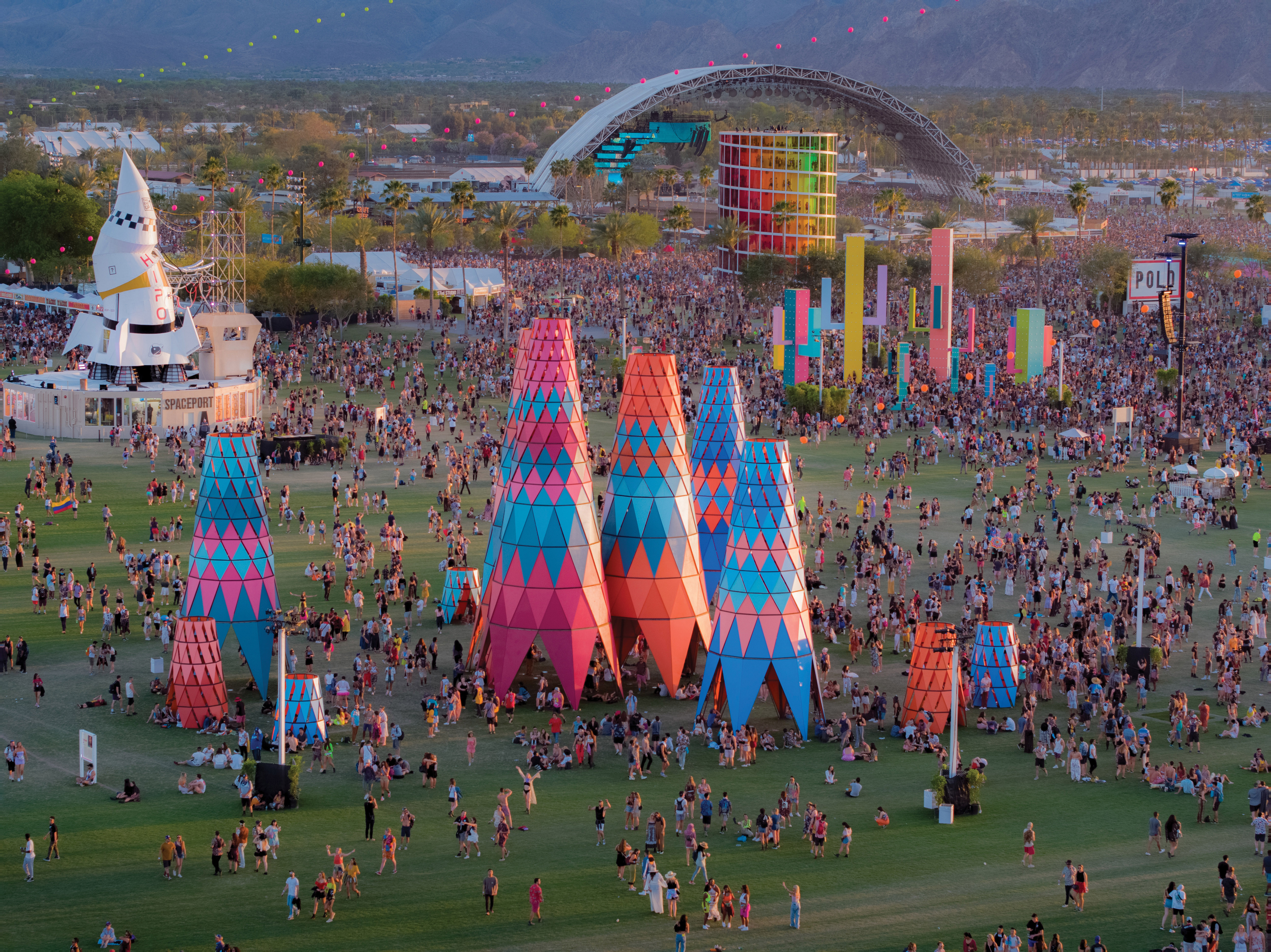 An aerial photo of the Coachella music festival art installations and thousands of concert-goers.