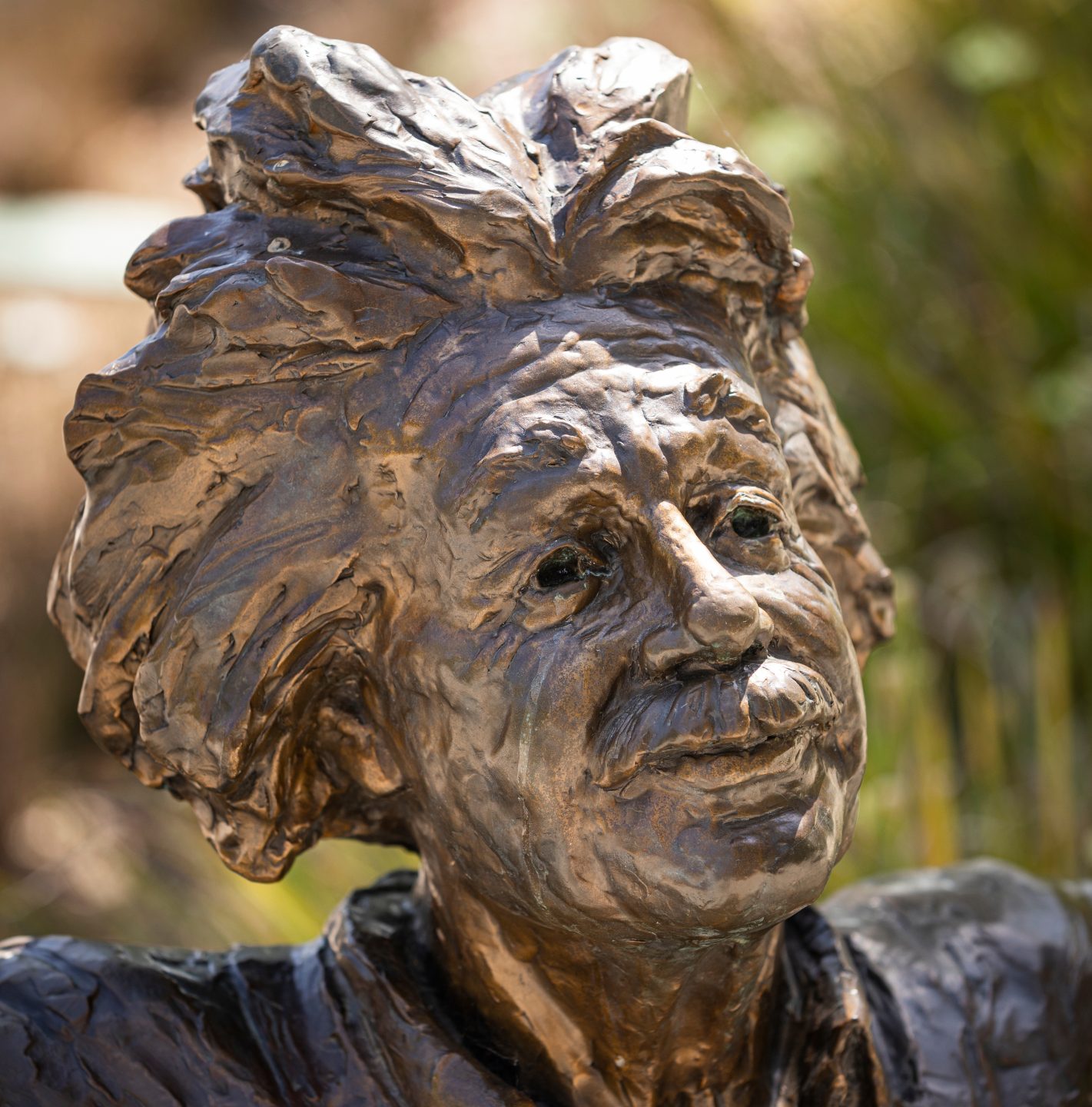 The face of a bronze statue of Albert Einstein