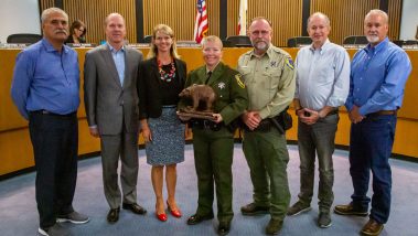 Game warden Anastasia Norris accepts an award from the California Department of Fish and Wildlife's Law Enforcement Division