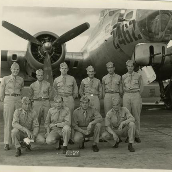 10 student pilots stand next to an airplane at the San Luis Obispo airport in 1943