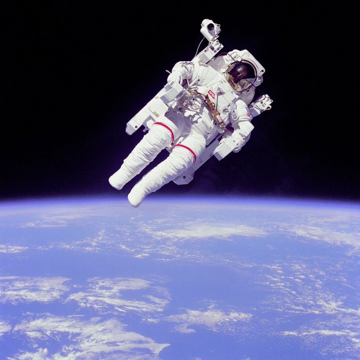 An astronaut floats above earth during an unteathered spacewalk