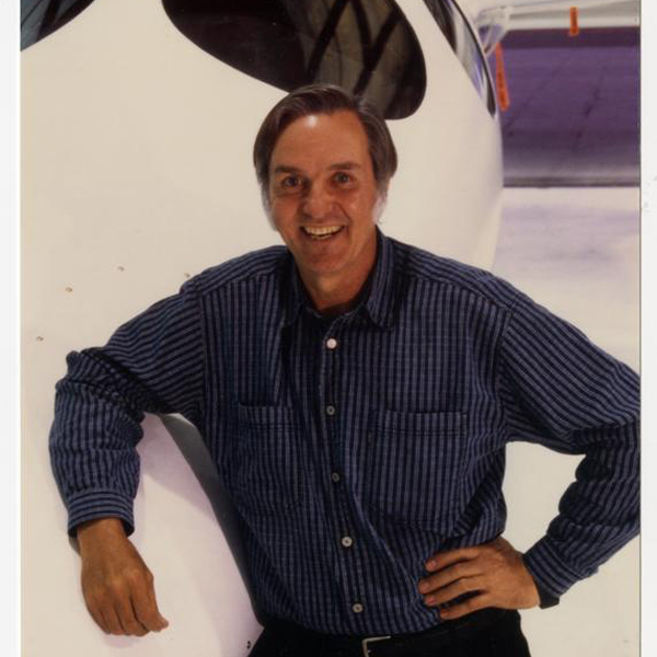 Burt Rutan smiles next to SpaceShipOne