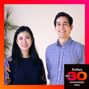 Jenn Chin and her cofounder smile in a photo framed in red with the words 'Forbes 30 Under 30 Honoree 2021'
