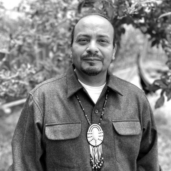 A black and white headshot of José Navarro