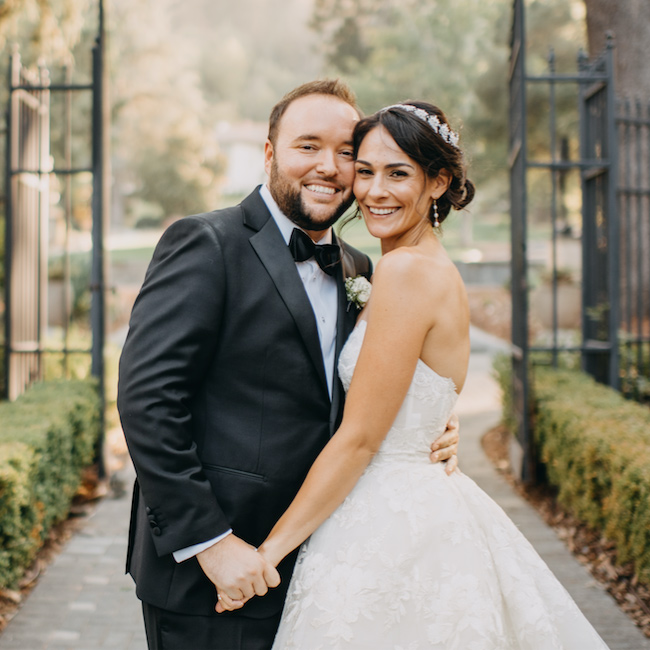 Joshua and Antonia Burroughs smile on their wedding day.