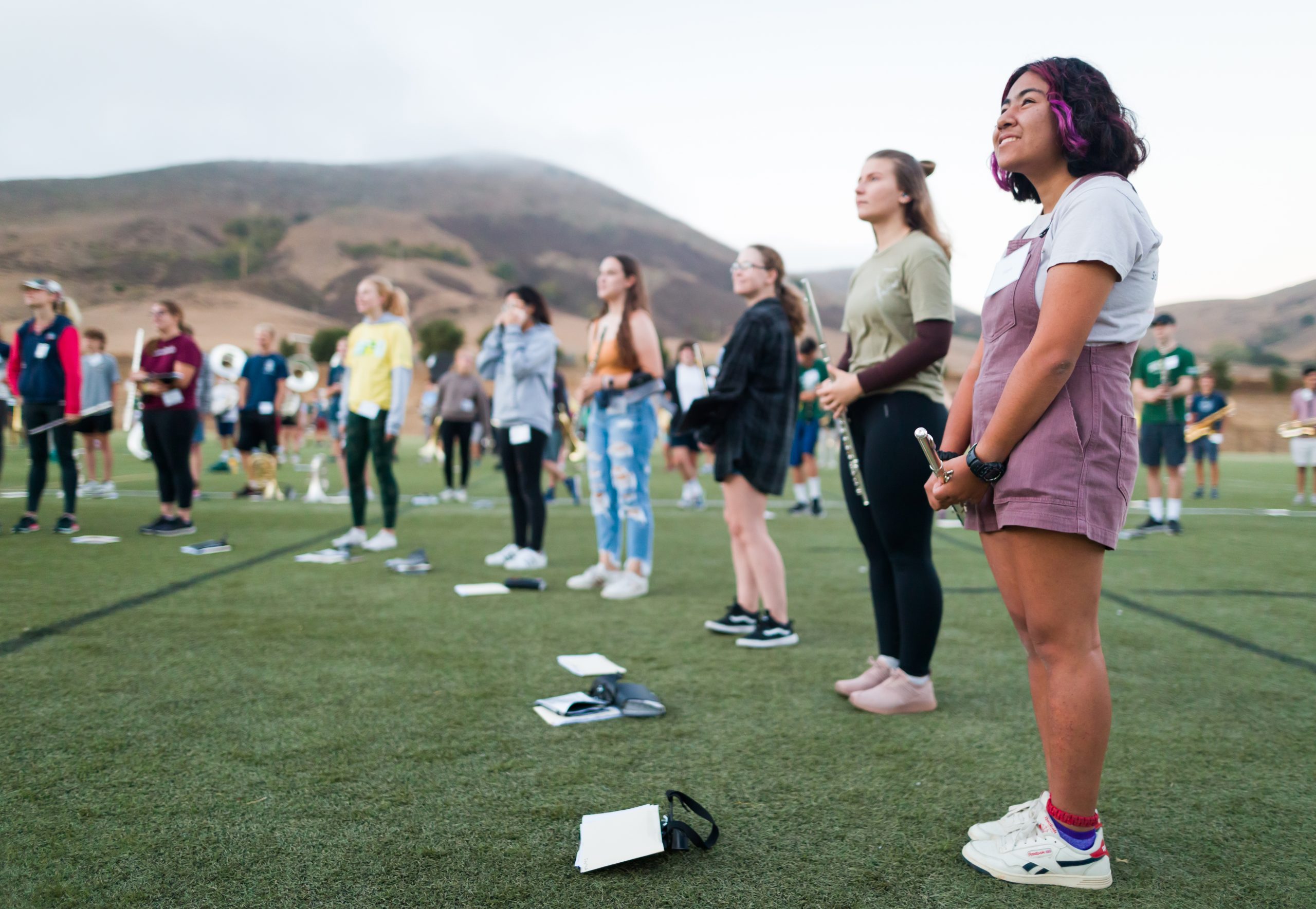 The flute section lines up on a Cal Poly field for the first Mustang Band practice since the pandemic