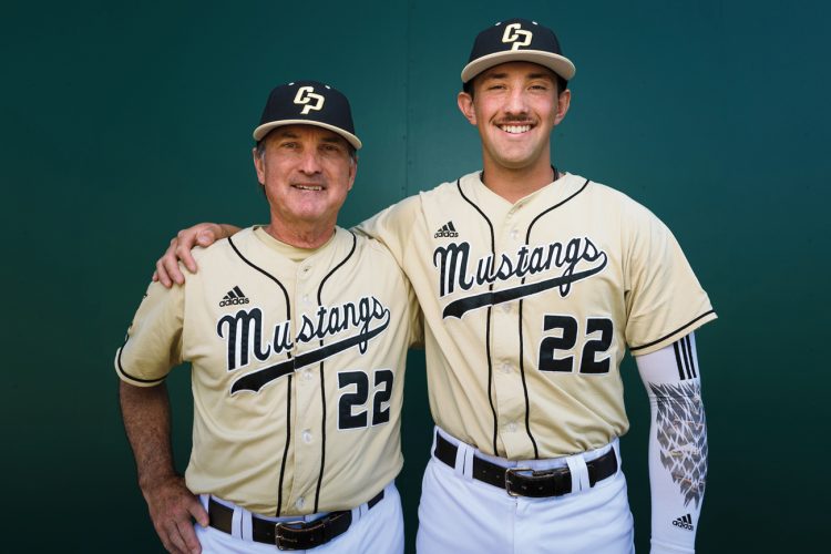 Coach Larry Lee and Brooks Lee smile in uniform