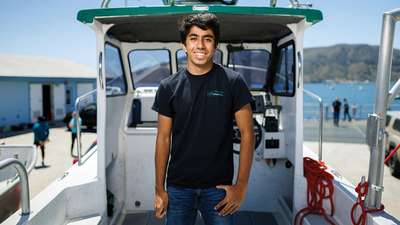 A student on the deck of a boat
