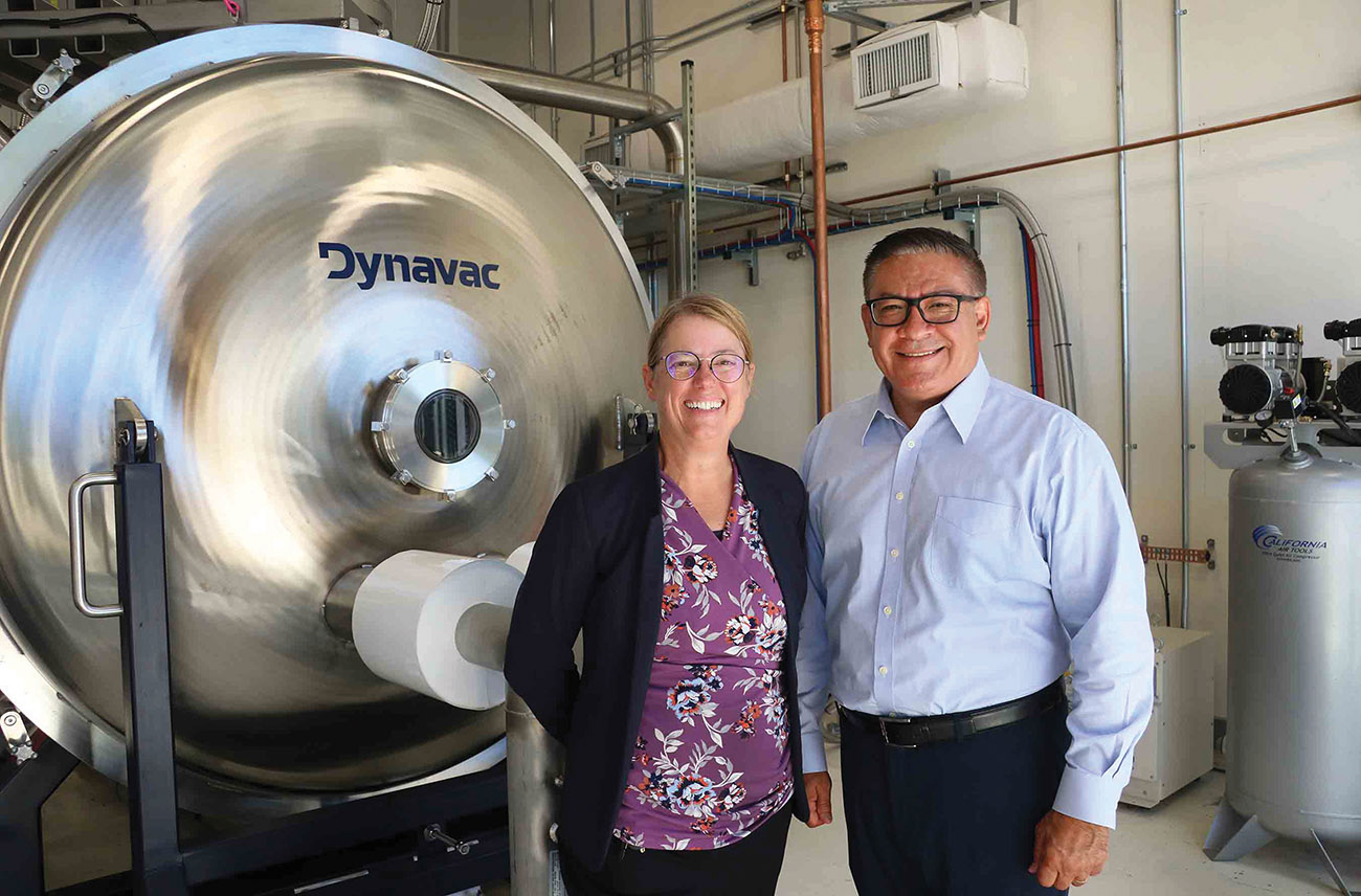 Congressman Salud Carbajal and Dean Amy S. Fleischer with the CubeSat vacuum chamber