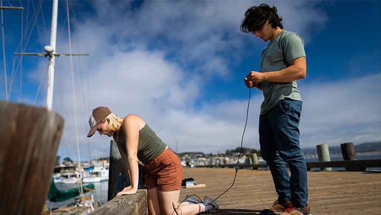 Students work on a pier