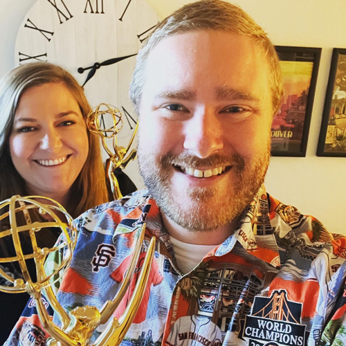 Lindsay and Ed Zuchelli hold Emmy trophies