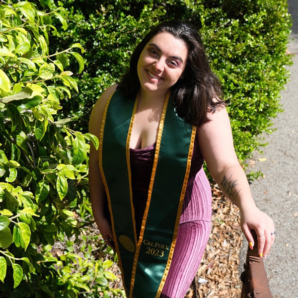 Alexis Morse in a green graduation stole