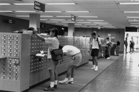 Students use a library card catalog in Kennedy Library in the 1980s