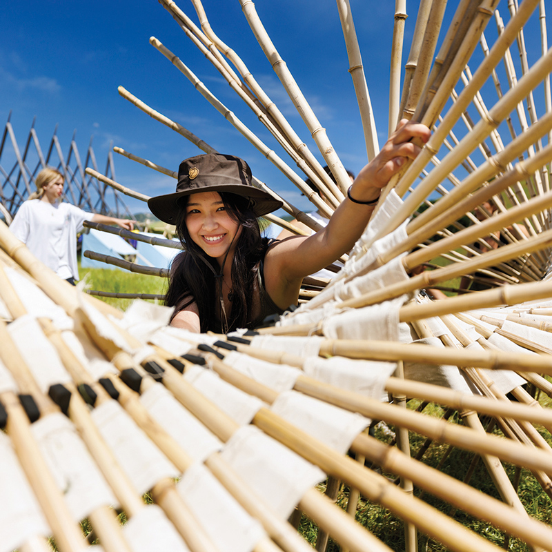 Students work with a unique structure at an architecture design competition