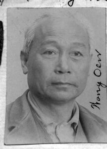 A black and white photo of a man with the written caption "On Wong"