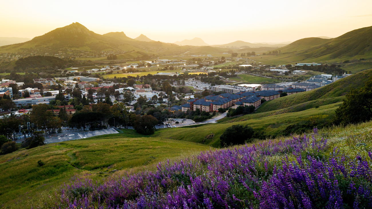 A view of Cal Poly's campus from a nearby peak during sunset