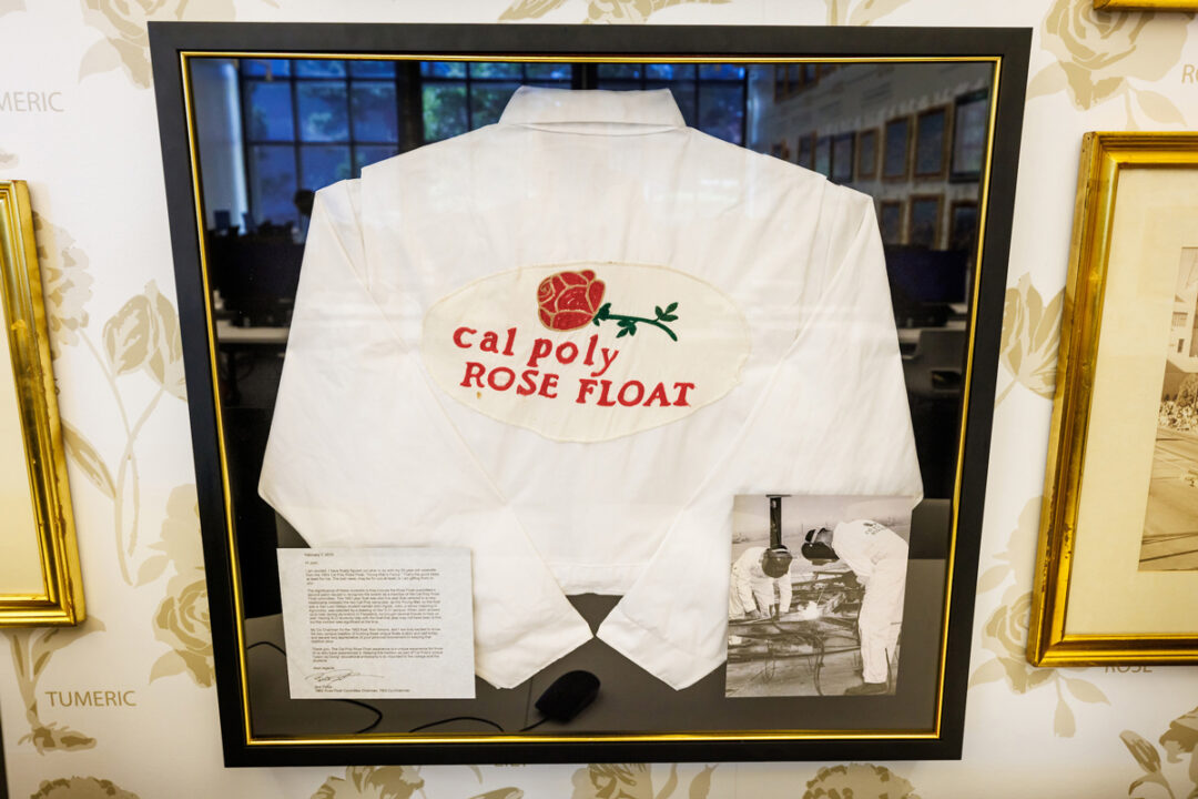 A framed set of white rose float coveralls in San Luis Lounge