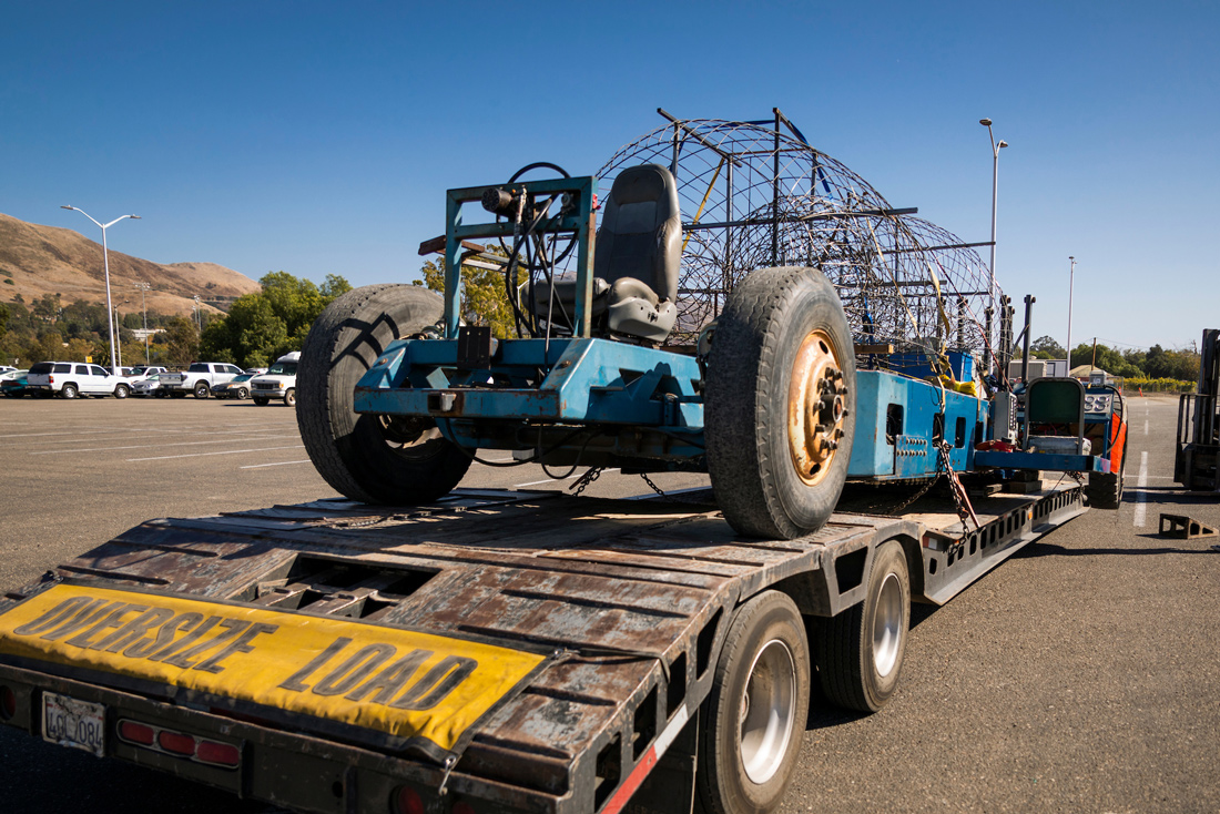 San Luis Obispo's Rose Parade float base sits on a flatbed truck with a Wide Load sign