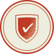 A circular icon with a shield and a check mark