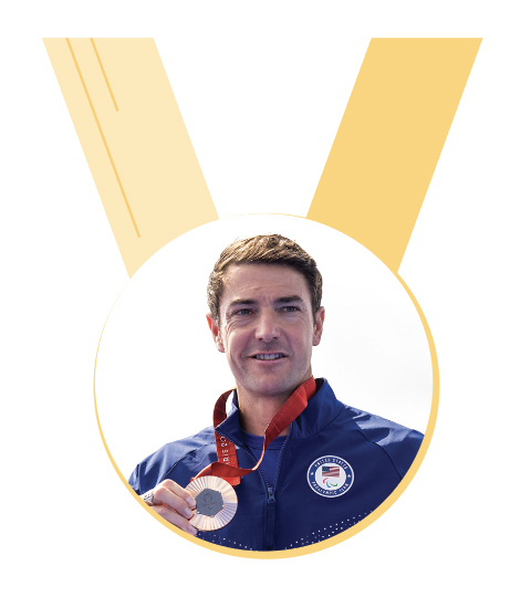 Medal graphic with Mark Barr photo in circle.