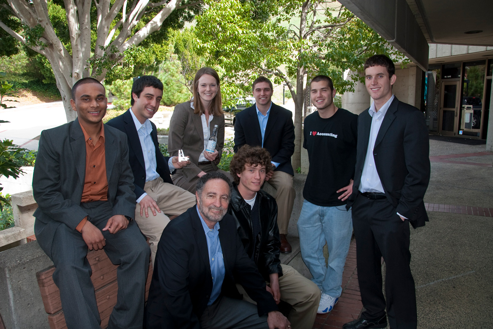 A group of entrepreneurship students including Brian Riley and professor Jon York