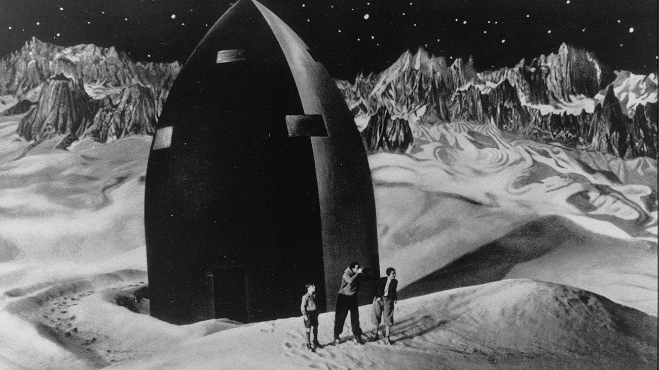 A black and white landcape featuring space explorers and a rocket ship from the film The Woman in the Moon