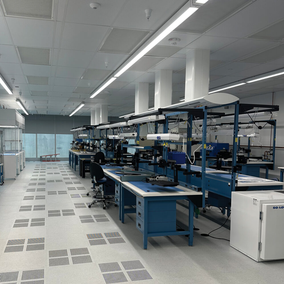 Jet Propulsion Laboratory's Microelectronics lab, with blue cabinets, work stations and tools.