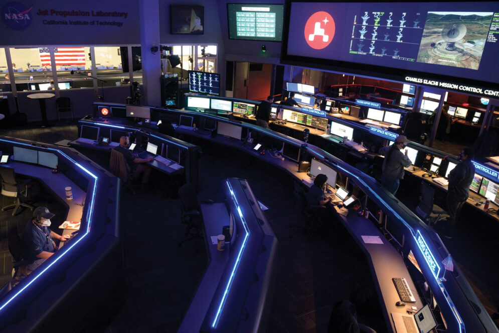 The Charles Elachi Mission Control Center at Jet Propulsion Laboratory, with blue lights, large monitors and colorful displays