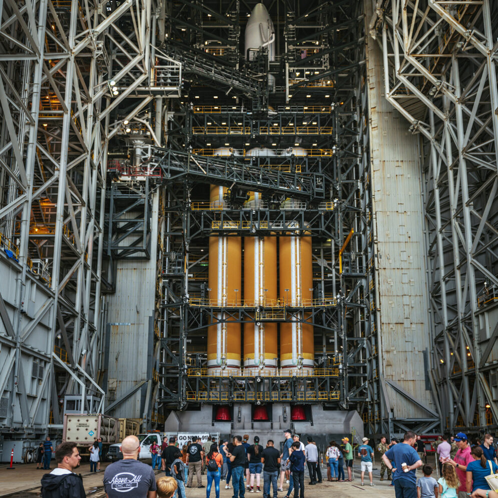 Community members observe a Delta IV Heavy rocket at Vandenberg Space Force Base.
