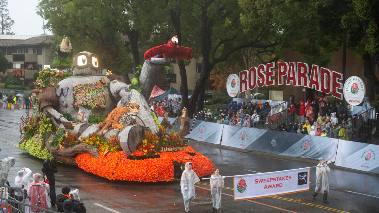 The 2026 Cal Poly Rose Float on the parade route with the Sweepstakes Trophy banner
