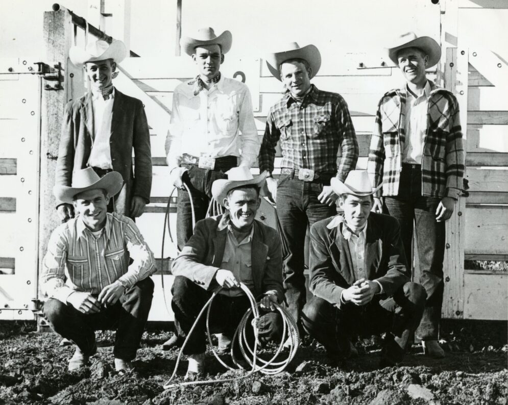 The Cal Poly Rodeo posing together with their hats and ropes.