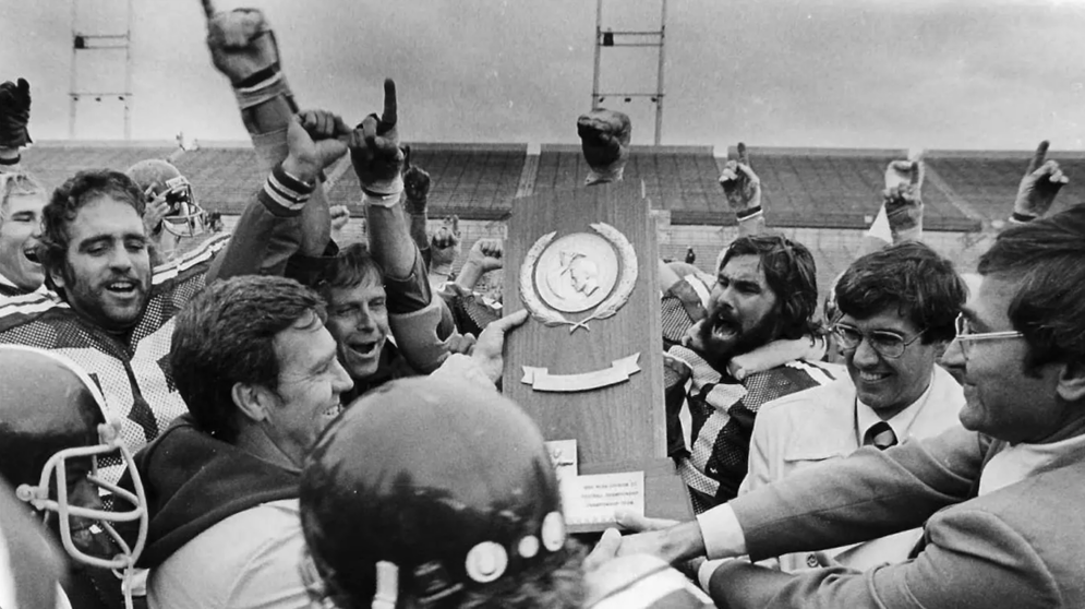 The 1980 football team celebrating their championship win.