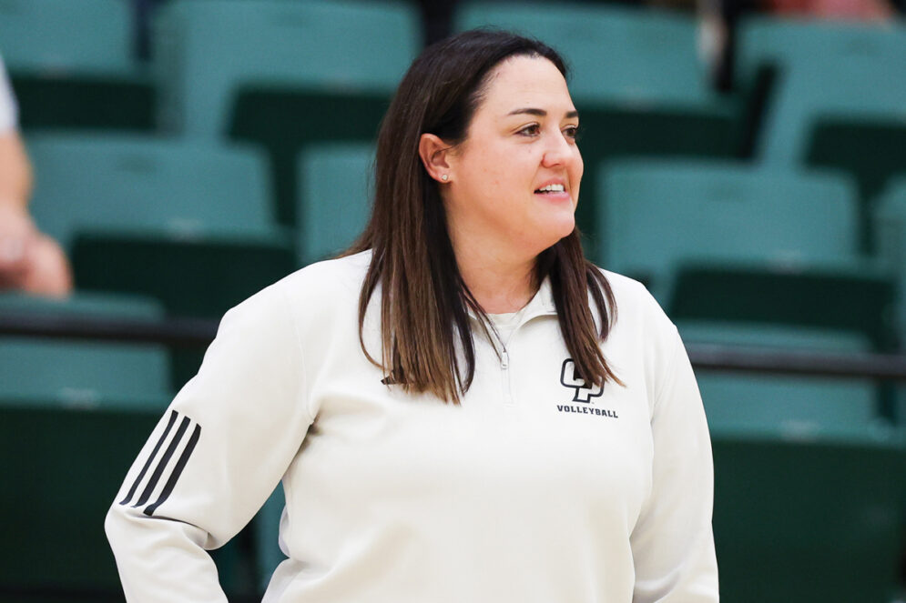 Cal Poly Volleyball coach Caroline Walters on the sidelines in Mott Gym