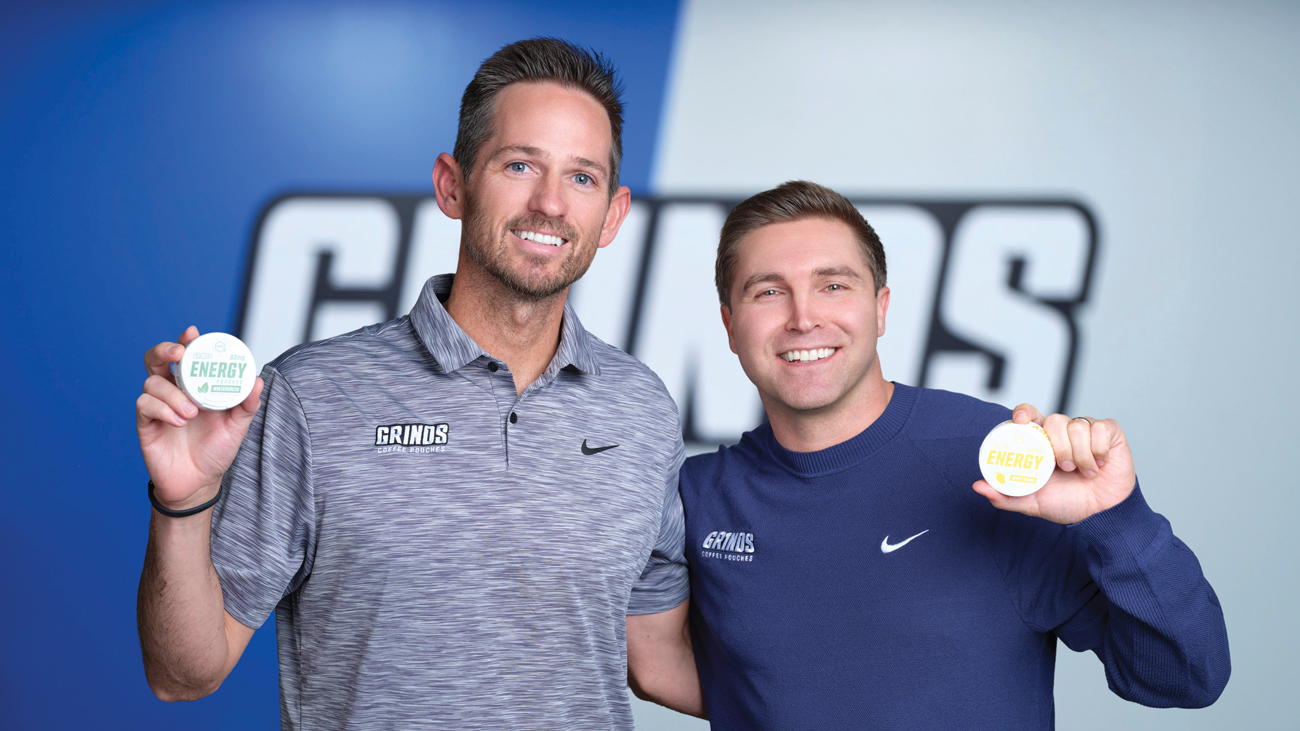 Grinds founders Matthew Canepa and Patrick Pezet smile while holding packages of Grinds Pouches