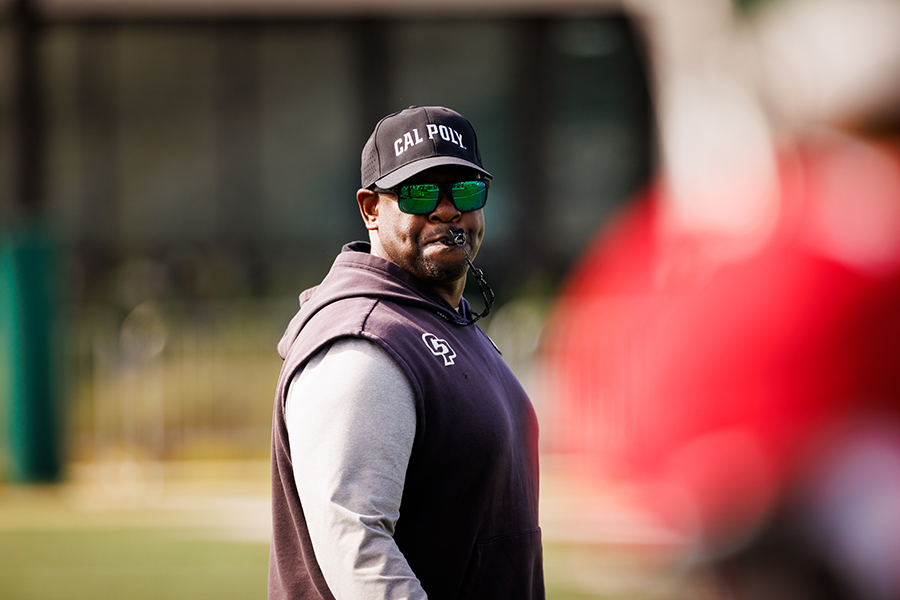 Head coach Tim Skipper blowing a whistle during practice.